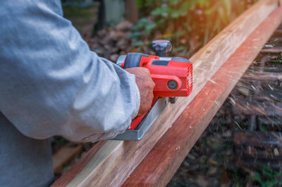 Close-up of man working on wood