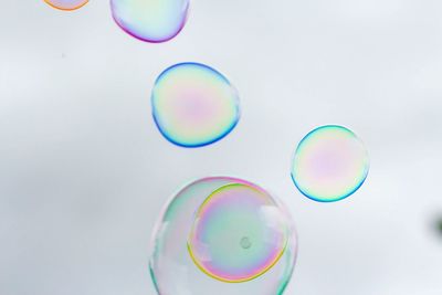 Close-up of bubbles against sky