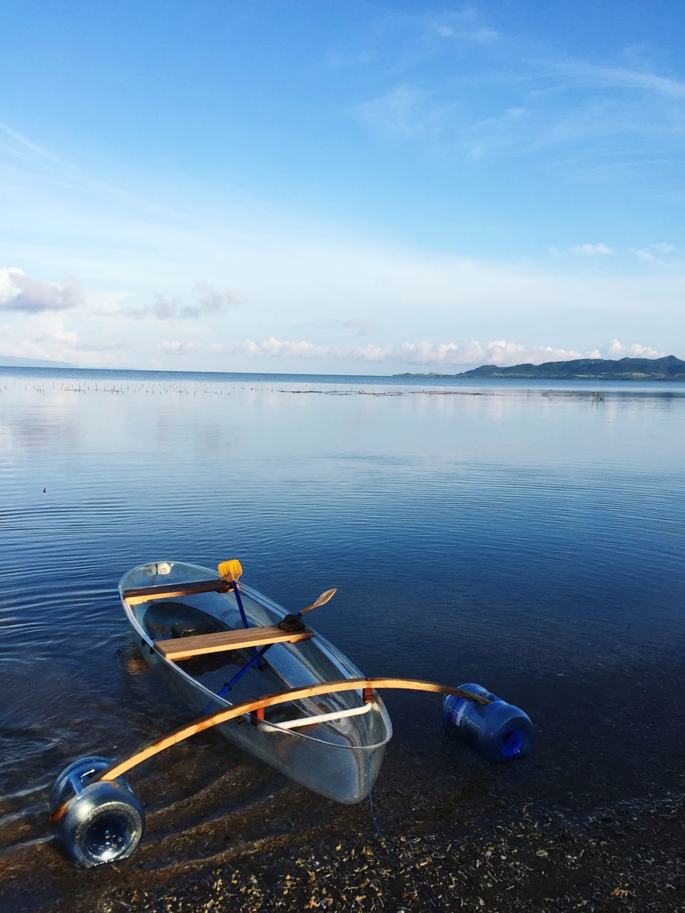 water, sky, transportation, nautical vessel, mode of transportation, beauty in nature, nature, scenics - nature, tranquil scene, day, no people, tranquility, cloud - sky, blue, moored, idyllic, non-urban scene, sea, outdoors