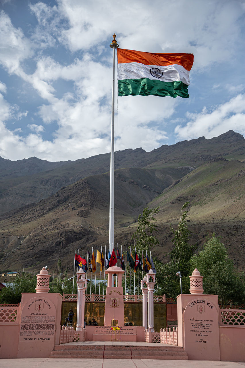 FLAGS ON TEMPLE AGAINST SKY