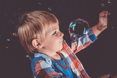 Portrait of cute boy looking away