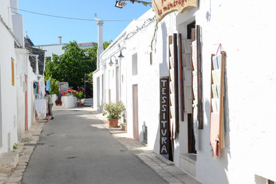 Alley amidst buildings in city