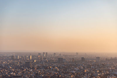 High angle view of city at sunset