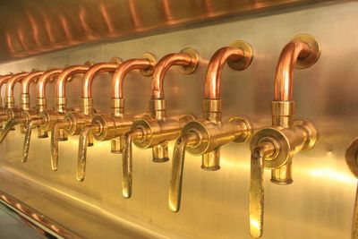 Close-up of beer taps at bar