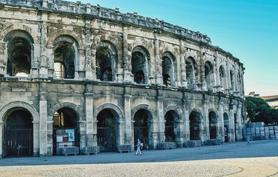 People in front of historical building