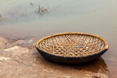 High angle view of wicker basket on beach