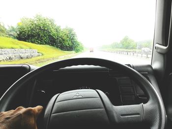 Cropped image of car on road