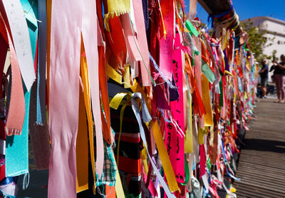 Multi colored ribbons hanging outdoors