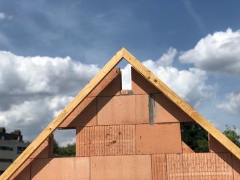 Close-up of built structure against sky