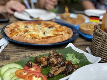 Close-up of pizza served on table