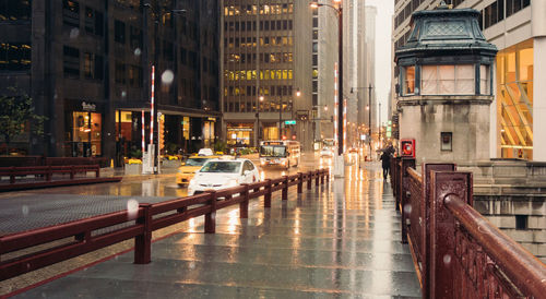 Cars on street in city during rain