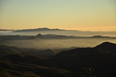 Scenic view of mountains at sunset