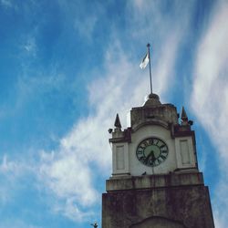 Low angle view of clock tower against sky