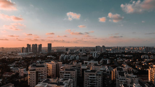 High angle view of buildings against sky during sunset