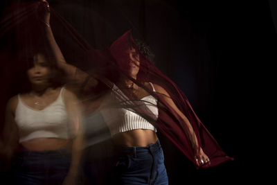 Time lapse view of woman moving a rag. long exposure, motion blur. happy woman. salvador, brazil.