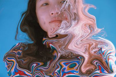 Digital composite image of woman with dissolve in water