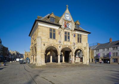 The guildhall building on stilts above the market space in cathedral square, peterborough