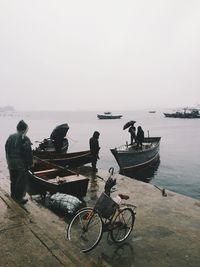 Man riding bicycle on beach