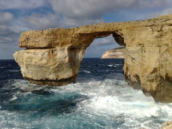 Azure window at gozo island against sky