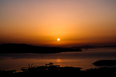 Scenic view of sea against orange sky