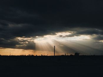 Scenic view of silhouette landscape against sky at sunset