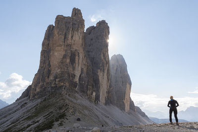 Full length of man on rock against sky