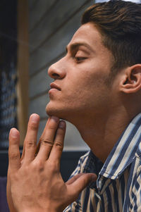 Portrait of young man looking away