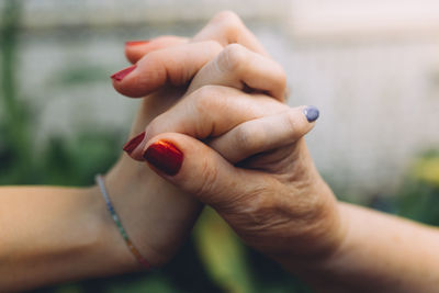 Close-up of woman holding hands