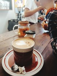 Close-up of coffee served on table at cafe