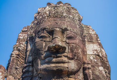 Low angle view of statue against sky