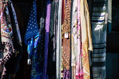 Multi colored flags hanging in store for sale in market