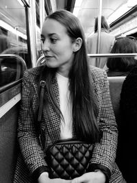 Young woman sitting in train