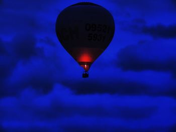 Low angle view of hot air balloon against blue sky
