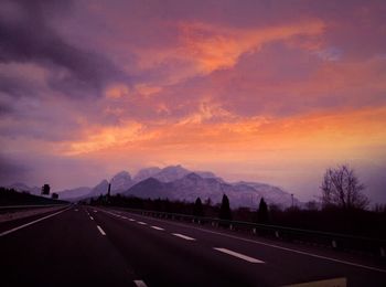 Road against dramatic sky during sunset