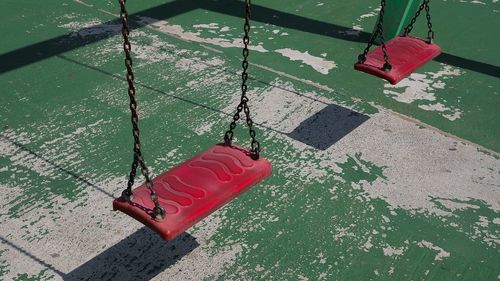 High angle view of red umbrella on wet floor
