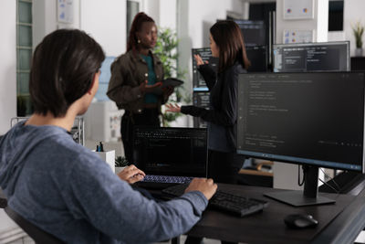 Side view of man working in office