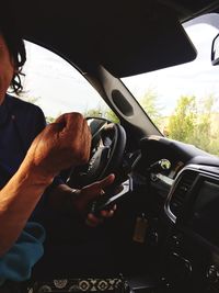 Close-up of man using mobile phone