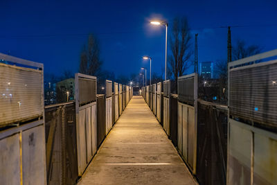 View of illuminated street lights at night