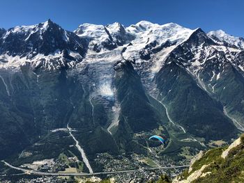 Aerial view of snowcapped mountains against sky