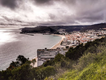 High angle view of city against cloudy sky