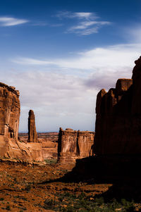 Scenic view of cliff against sky