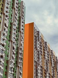 Low angle view of modern buildings in city against sky