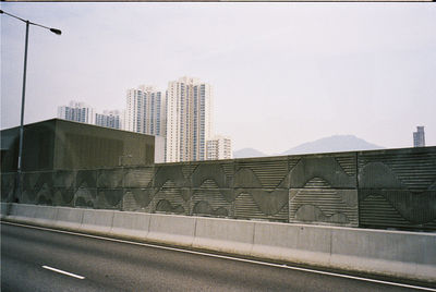 Modern buildings against sky in city