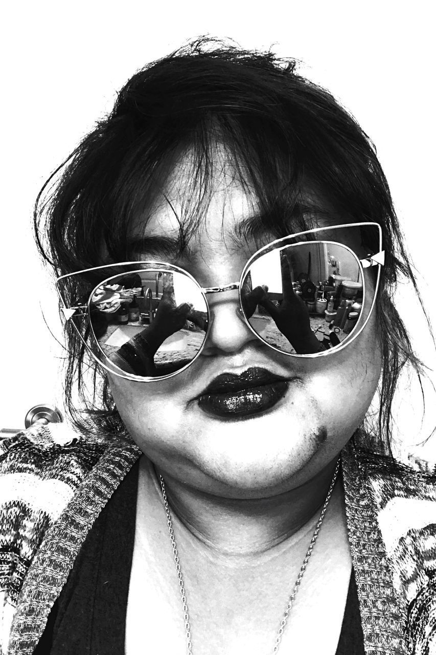 PORTRAIT OF GIRL WEARING SUNGLASSES