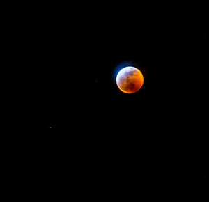 Scenic view of moon against sky at night