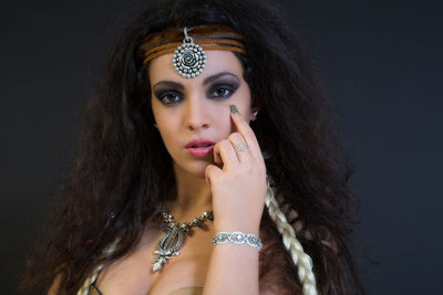 Close-up portrait of young woman with long hair