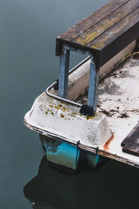 High angle view of old boat moored on lake
