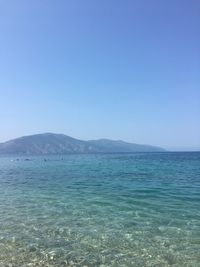 Scenic view of sea against clear blue sky