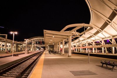 Empty railroad station platform at night