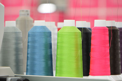 Close-up of multi colored spools in store